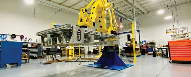 Robotic palletizer in an industrial setting, showcasing automation technology for efficient palletizing solutions.