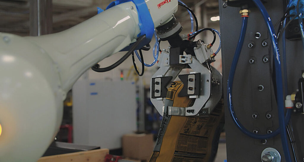 PASCO robotic valve bag placer placing building products bags.