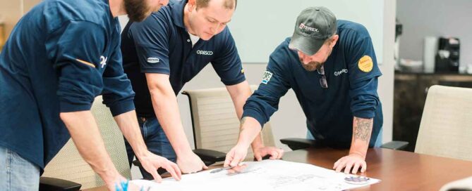 Pasco Systems Corp team members collaborating on a manufacturing automation layout in the United States.